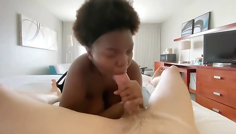 Brunette ebony girl with huge natural tits sucking a big cock