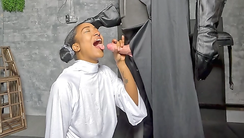 Ebony babe in a sexy lingerie sucks a dick in her mouth