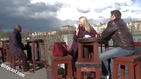 A teen blonde girl is getting a black dick on her face