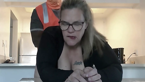 Mature blonde with a tattoo plays with her construction worker