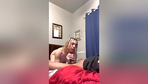 Blonde girl eats a big dick up in a interracial porn video